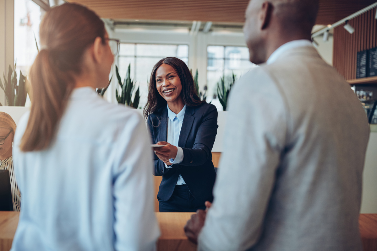 A businesswoman assisting customers