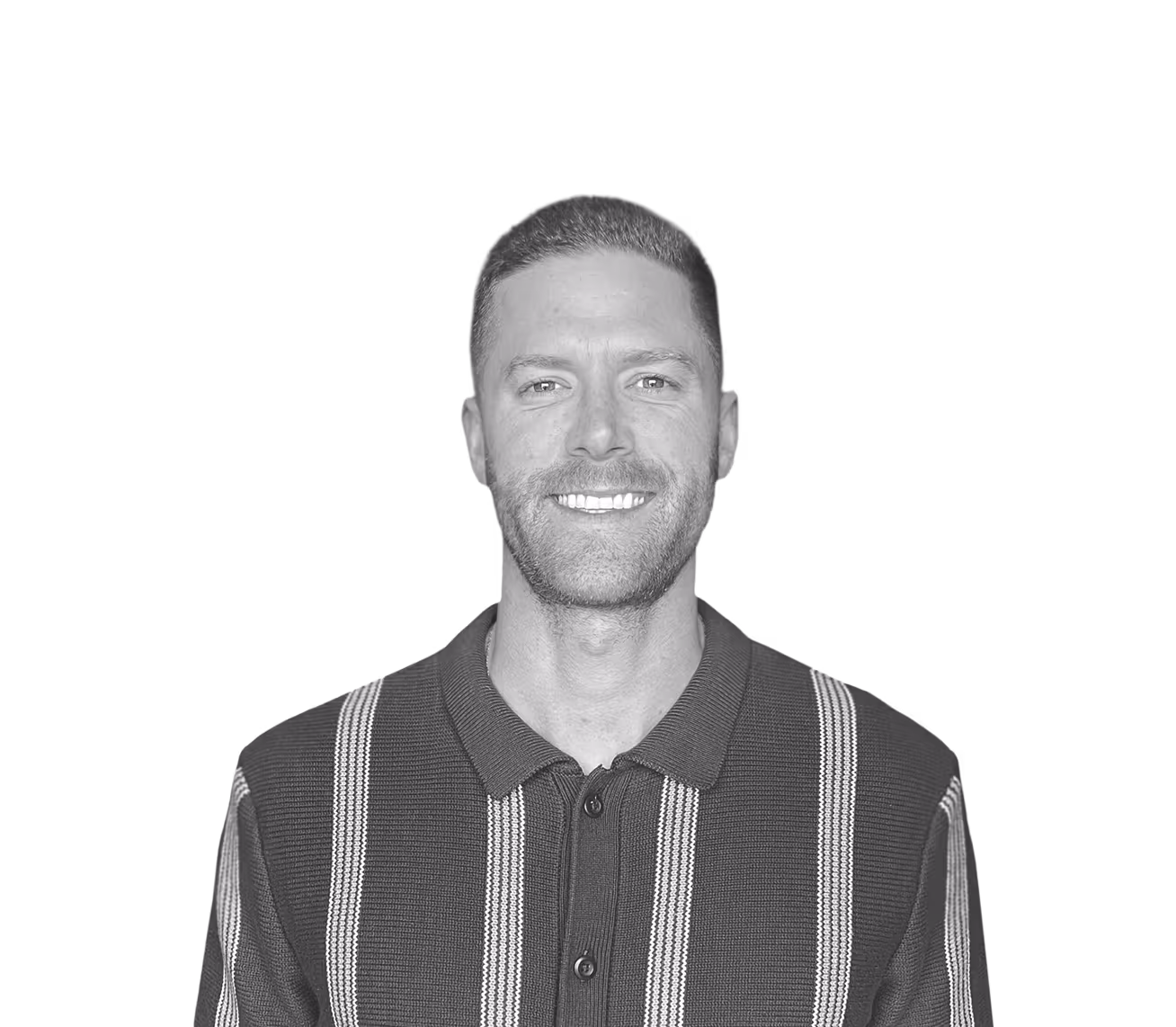 Smiling man with short brown hair and beard wearing a dark blue polo shirt with vertical light green and white stripes.