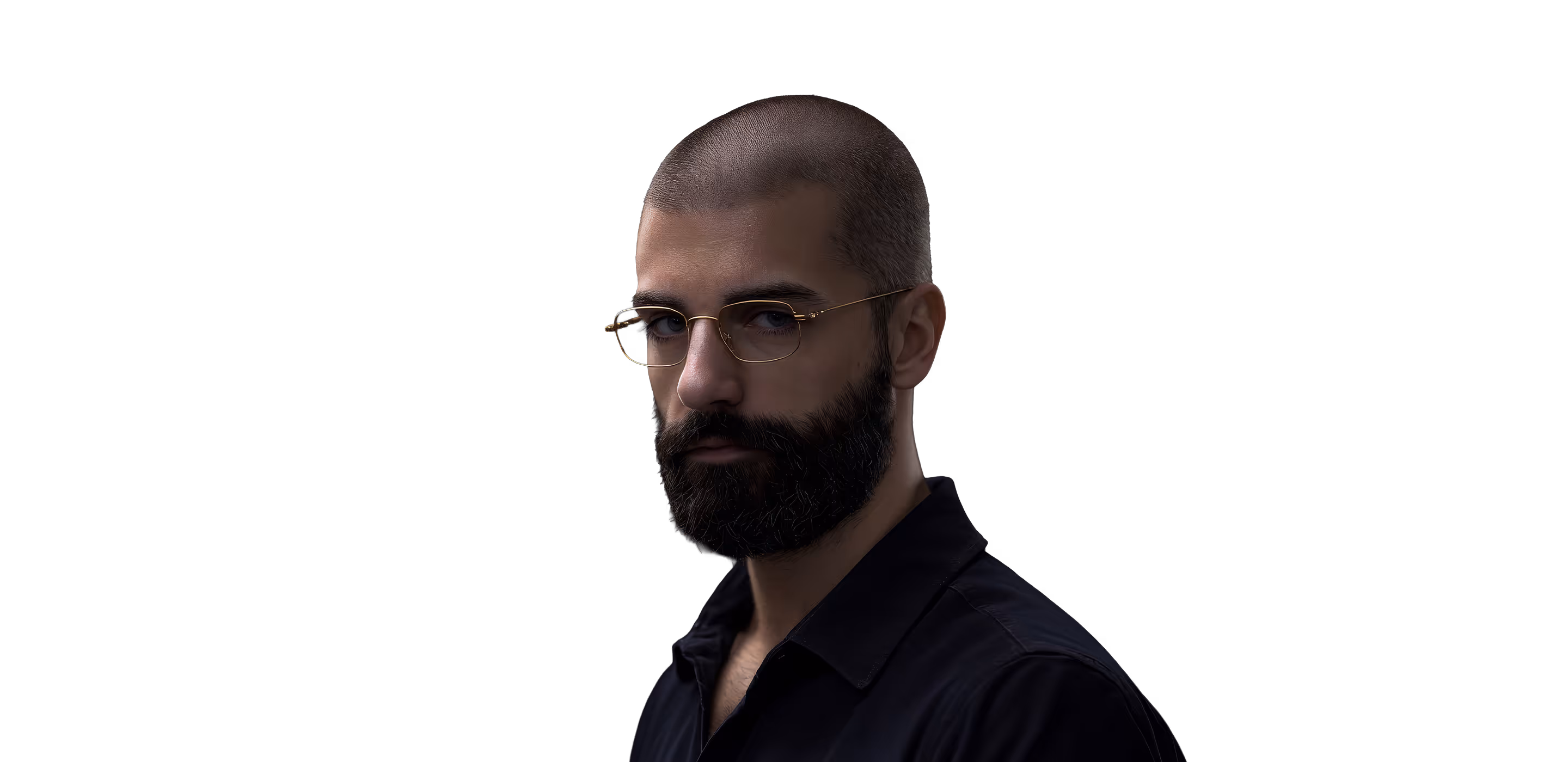 Man with a shaved head, full beard, and glasses wearing a dark shirt against a black background.