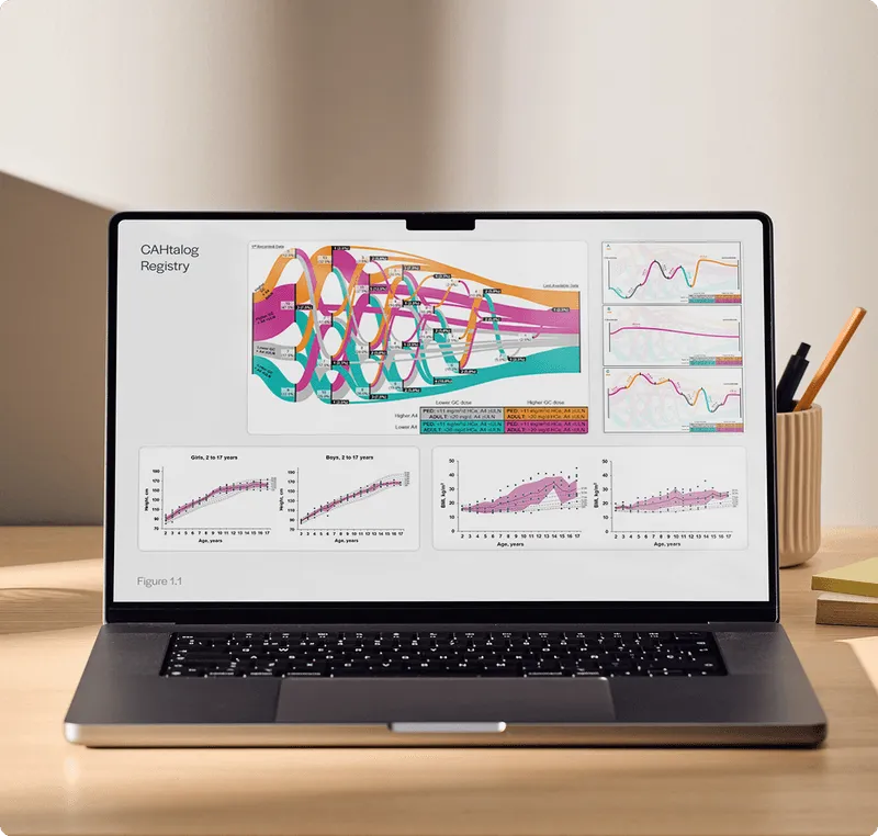 Laptop on desk displaying CAHtatalog Registry with colorful flow charts and growth graphs for boys and girls aged 2 to 17 years.