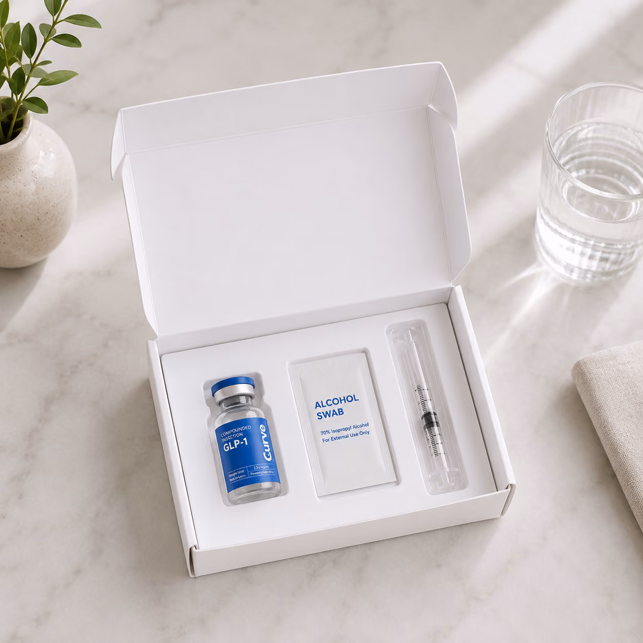 A white shipping box of GLP-1 medication being displayed.