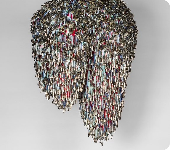 Marie Watt (Seneca, b. 1967). Sky Dances Light (Chorus) XIX, 2023-24. Tin jingles, polyester twill tape, polyester mesh, and steel, 60 x 48 x 48”. Courtesy of the artist and Marc Straus Gallery. © Marie Watt