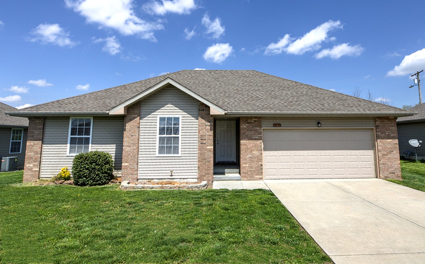 Single family rental home with a landscaped front yard in Republic, Missouri