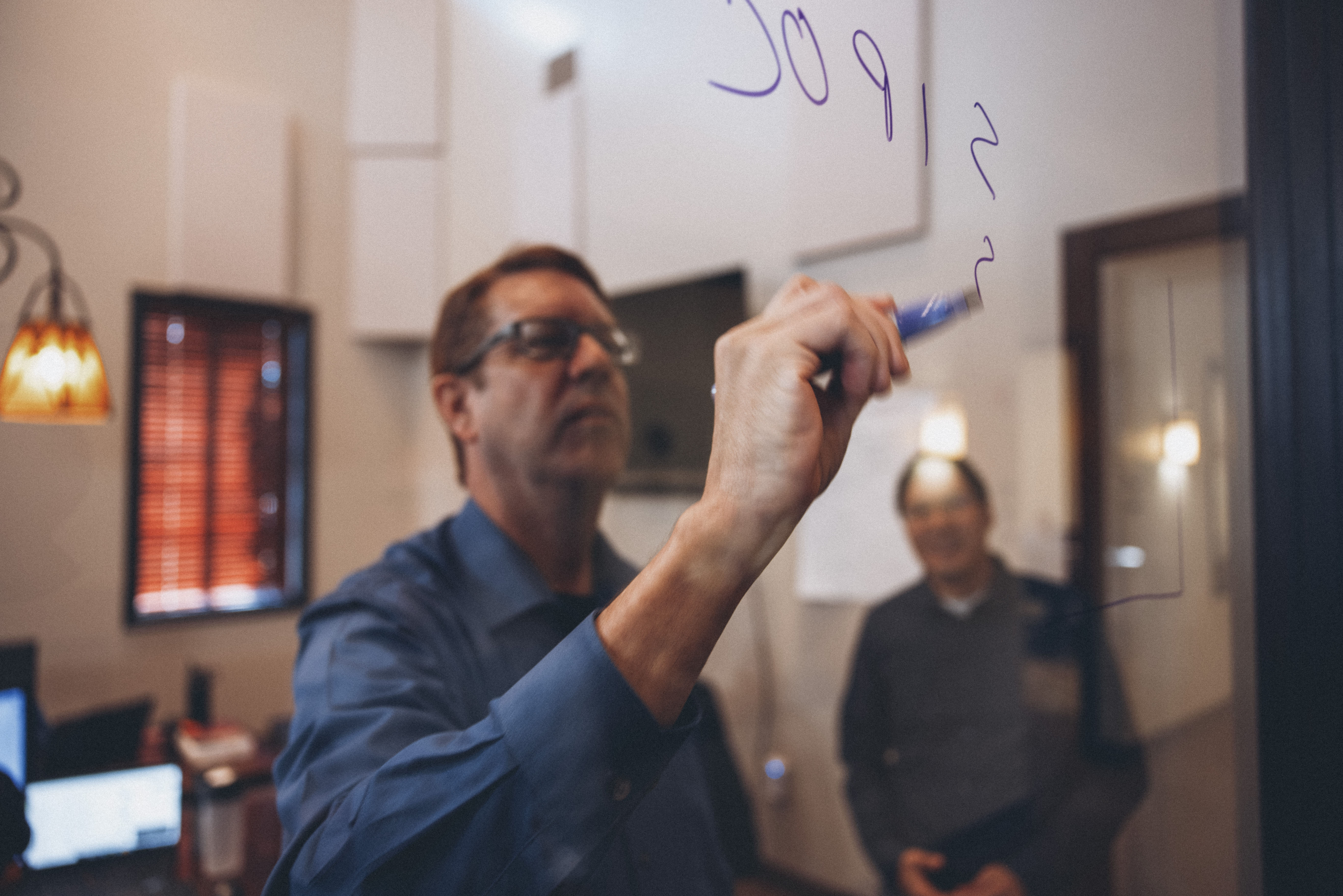 Working through a design on the glass wall