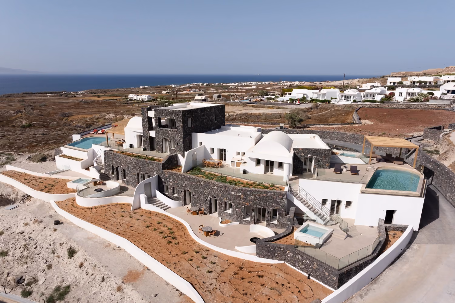 This is the Thumbnail for the Palatial Modern Villa in Santorini with Two Pools, Four Jacuzzis, and Fire Pits item