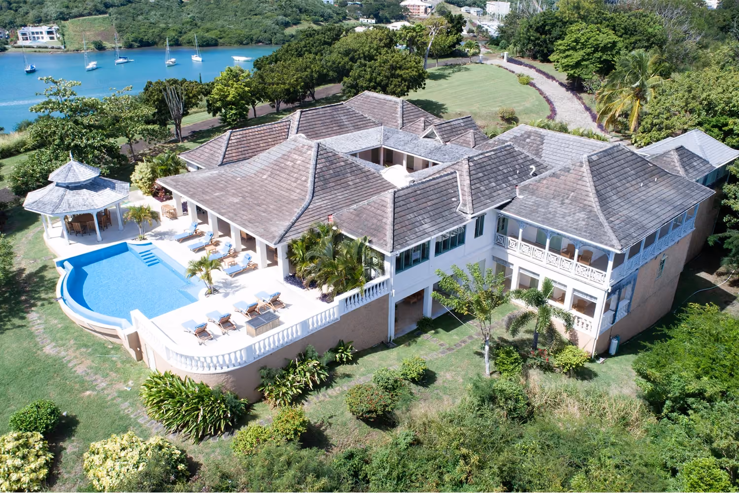 This is the Thumbnail for the Elegant Seafront Property Rental With Infinity Pool & Manicured Lawns in Calabash Private Resort in Grenada  item