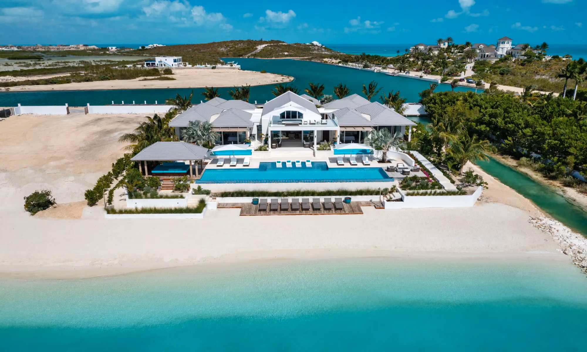 This is the Thumbnail for the Brand New Beachfront Estate With Home Gym, Private Beach, Infinity Pool & Water Views From Every Room item