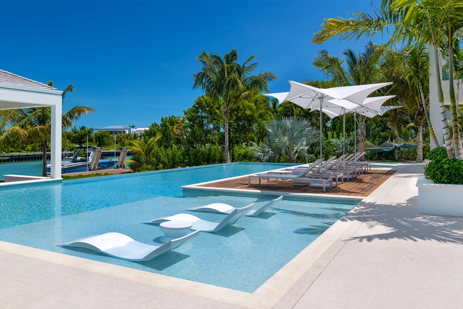 This is the Thumbnail for the Tranquil Grace Bay Villa With Pool, Hot tub, Private Dock, Gym, Movie Room, Firepit & Shared Sports Courts item