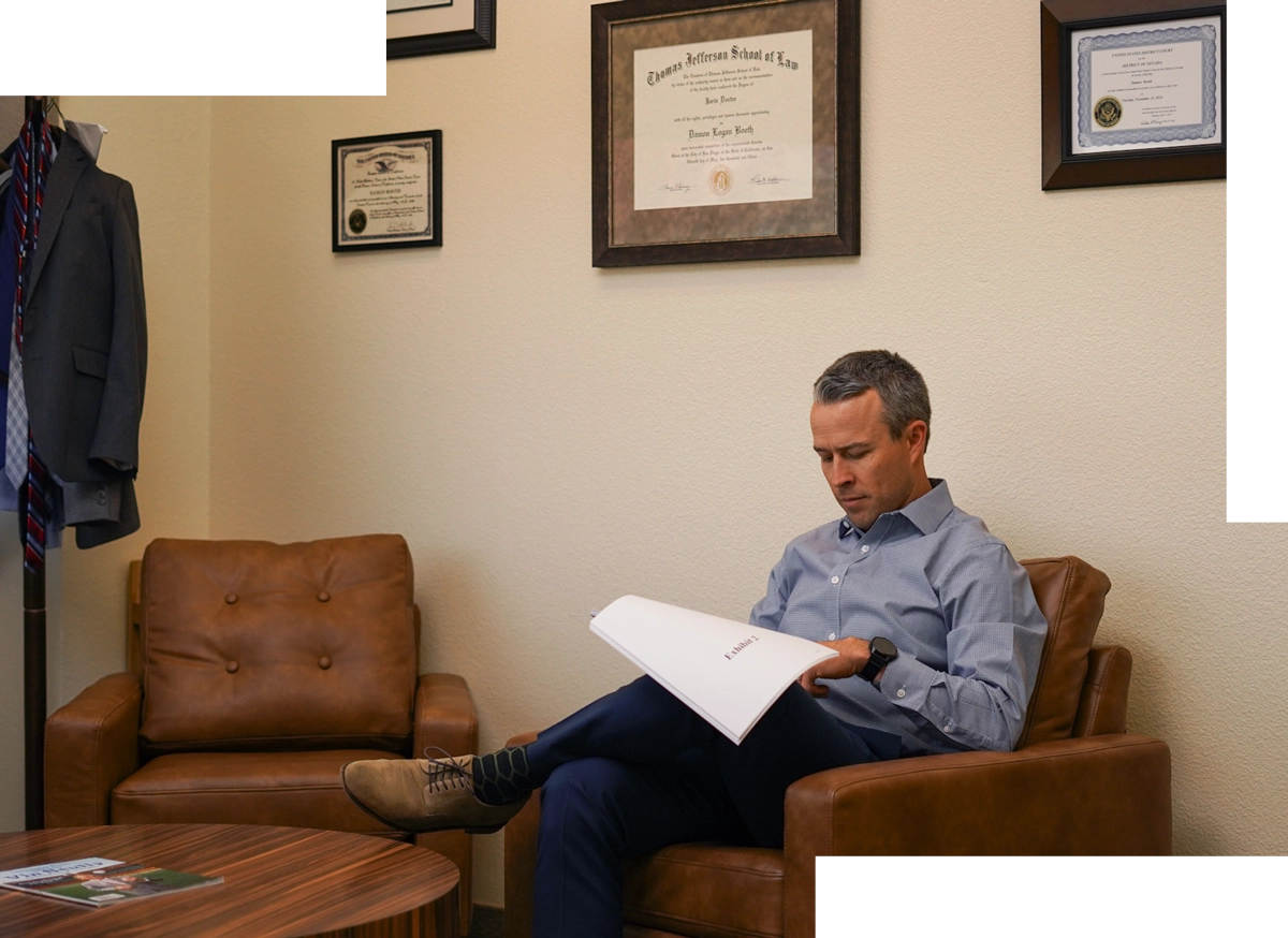 Attorney Damon Booth reviewing real estate contract
