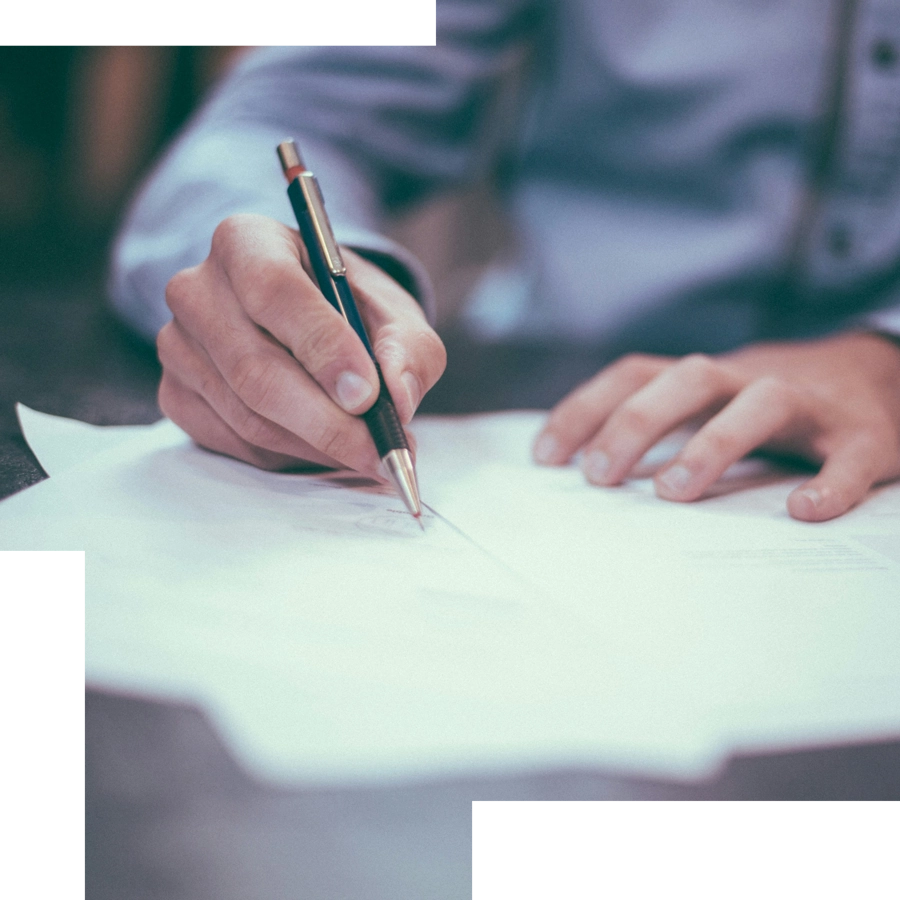 Male hand signing document