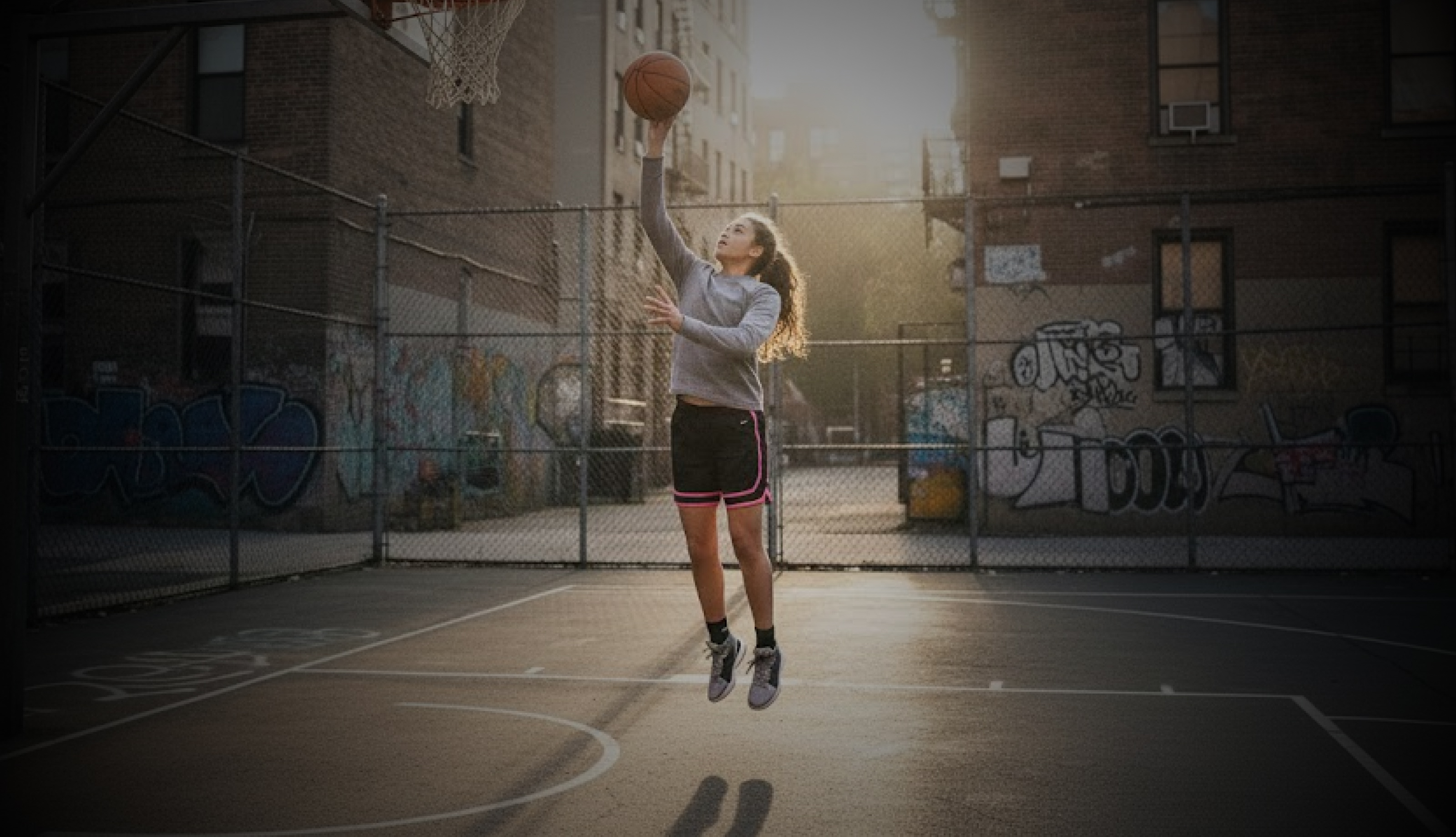 Female basketball player shooting