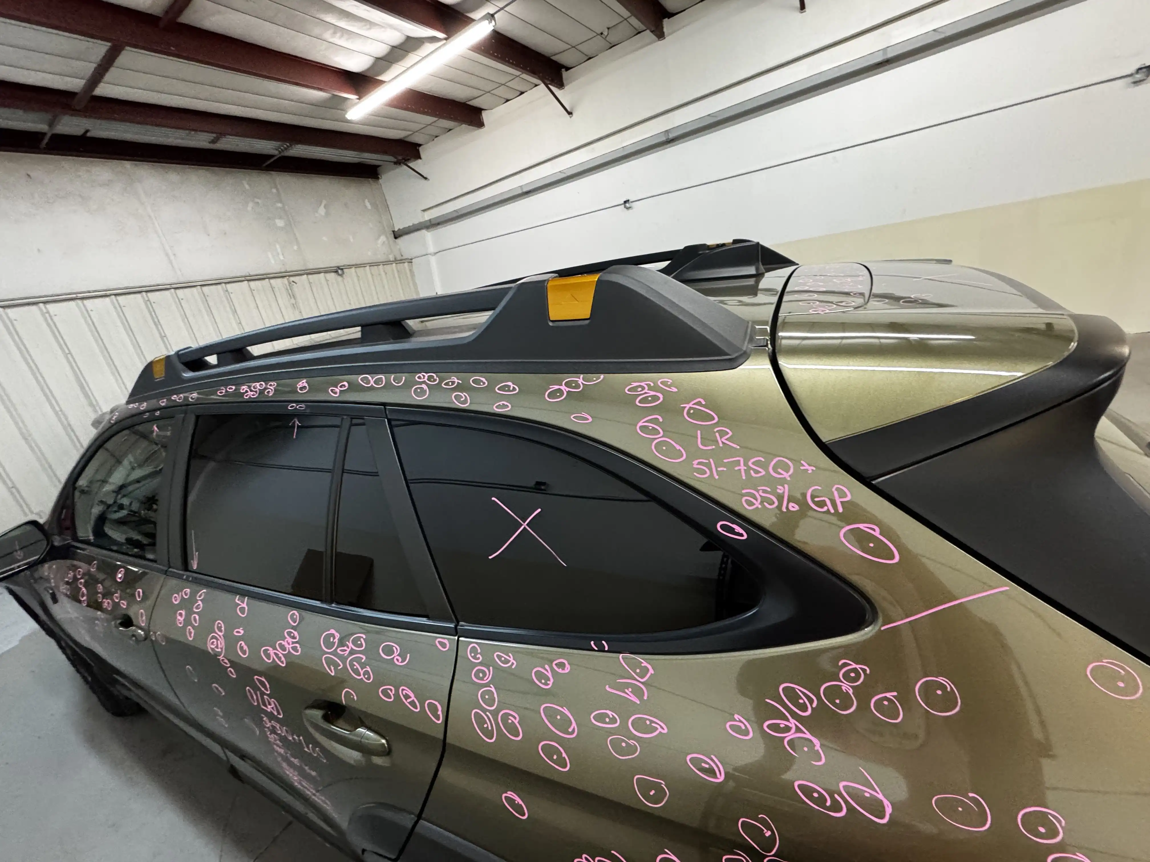 SUV with hail damage assessment markers