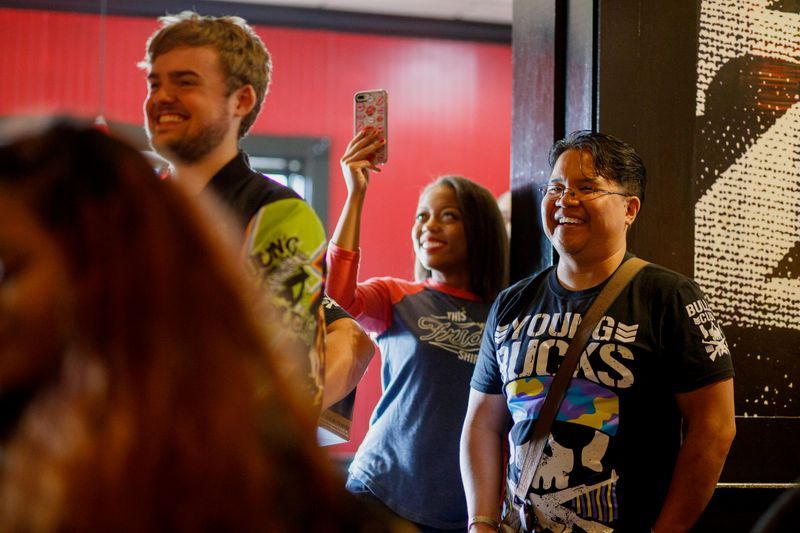 Amanda Mary M. Brown capturing content behind the scenes at an event