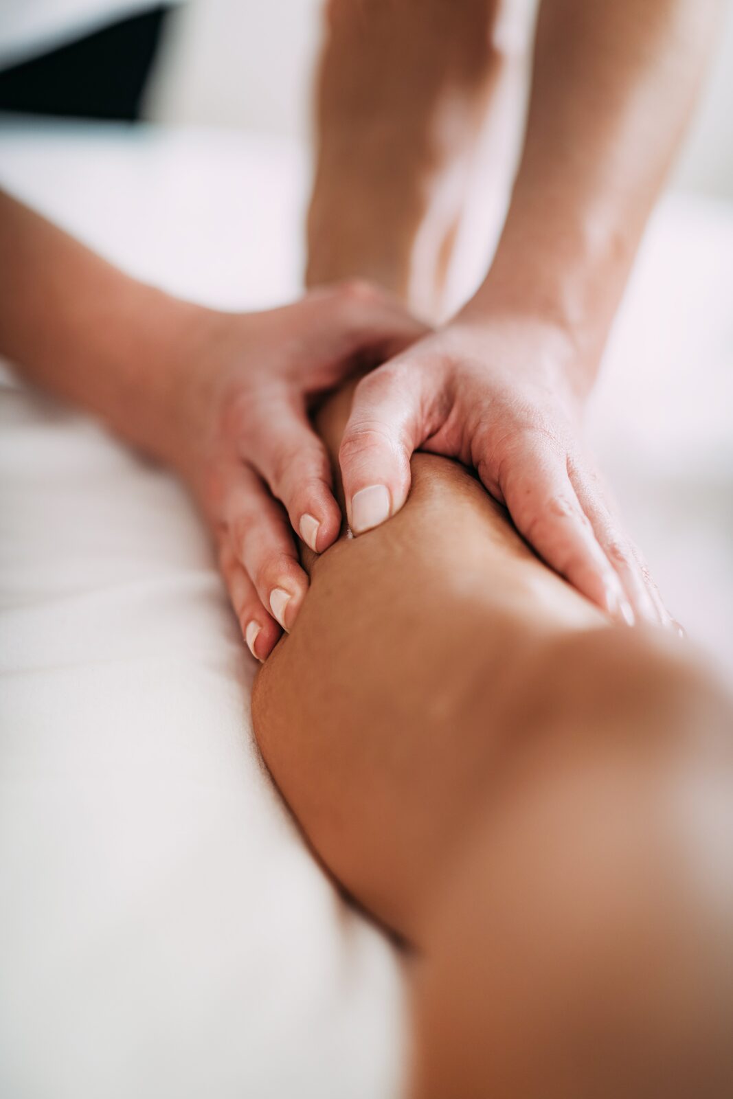 Close up of hands performing manual lymphatic drainage technique