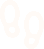 Pair of white footprint icons on a black background representing footsteps.