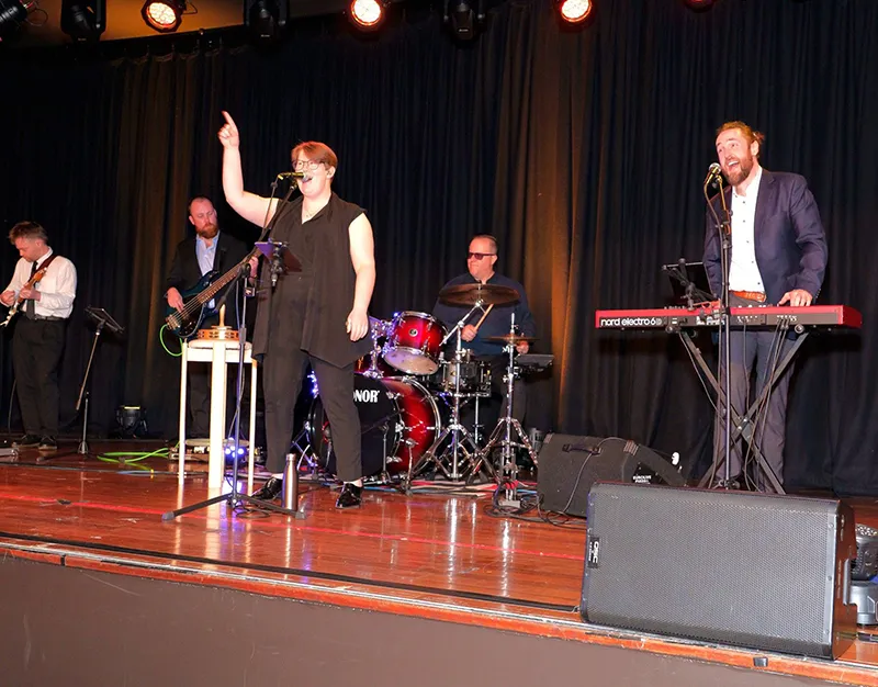 Capital Club band on stand performing at Black Friday Ball. 