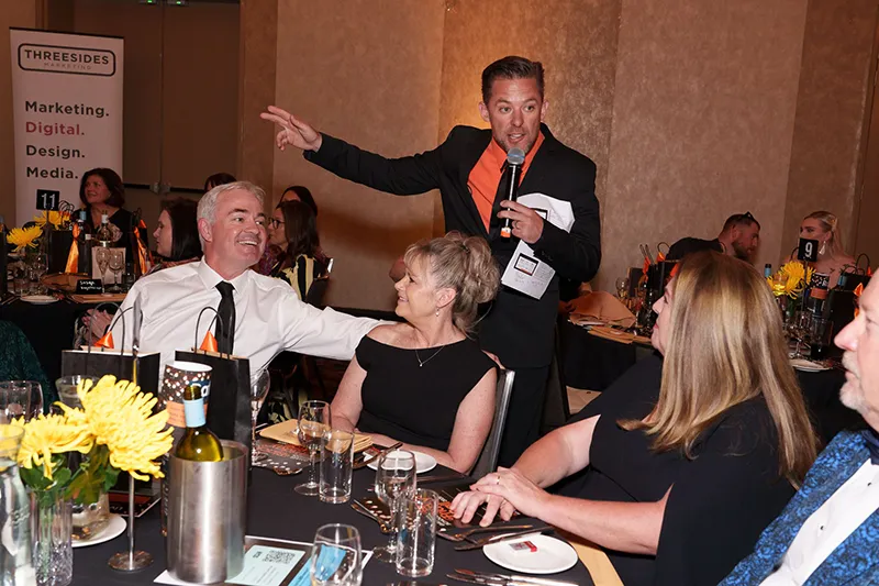 Black Friday Ball MC engaging with crowd.