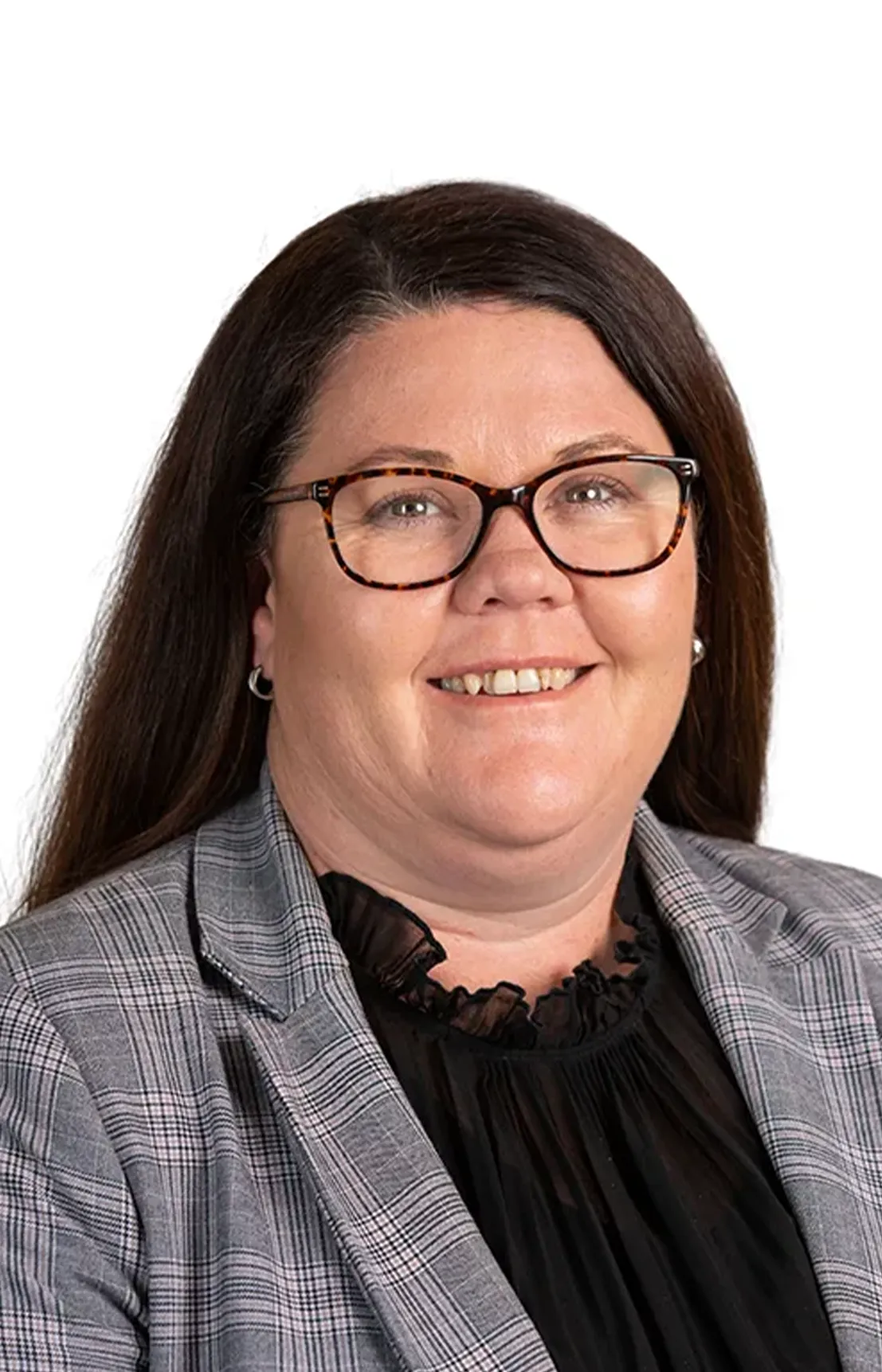 A woman wearing glasses and a black shirt smiling.