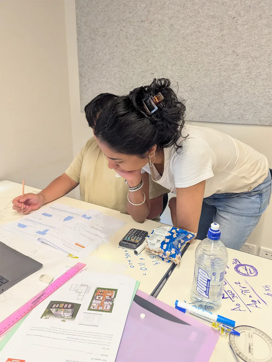 Year 12 coordinator helping a student with school work.