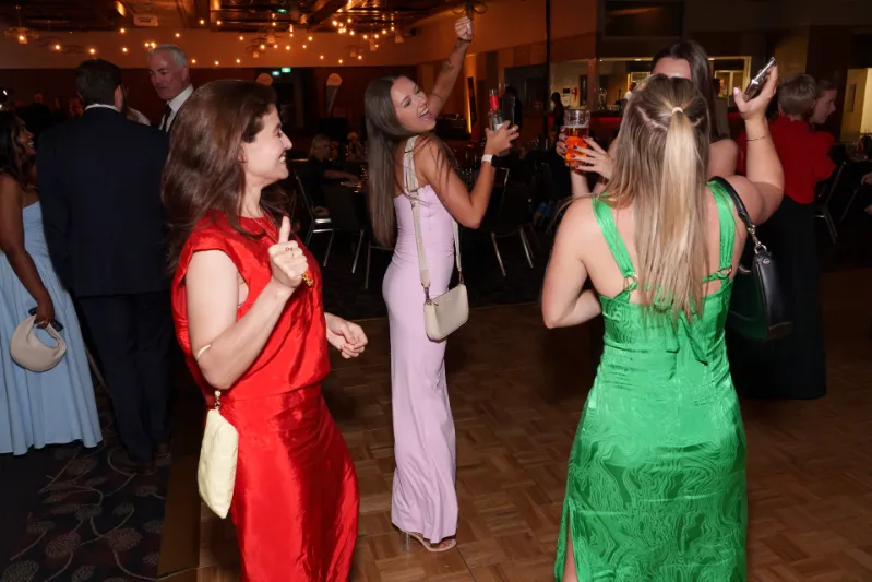 A group of people on the dancefloor at the Black Friday Ball. 