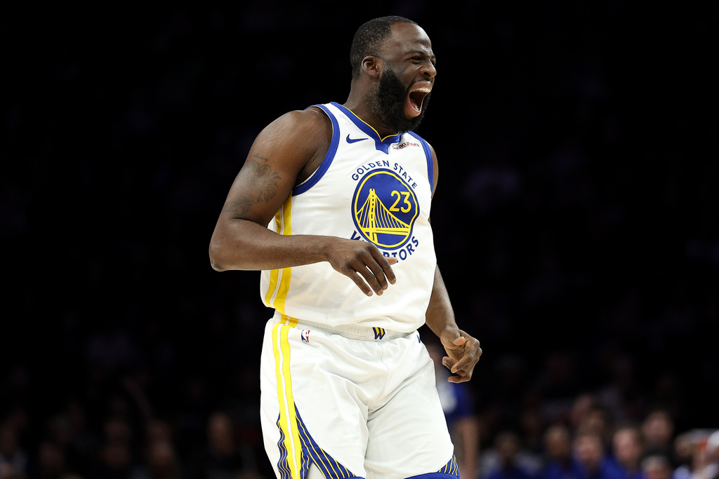 Golden State Warriors PF Draymond Green reacts to a miss against the Minnesota Timberwolves.