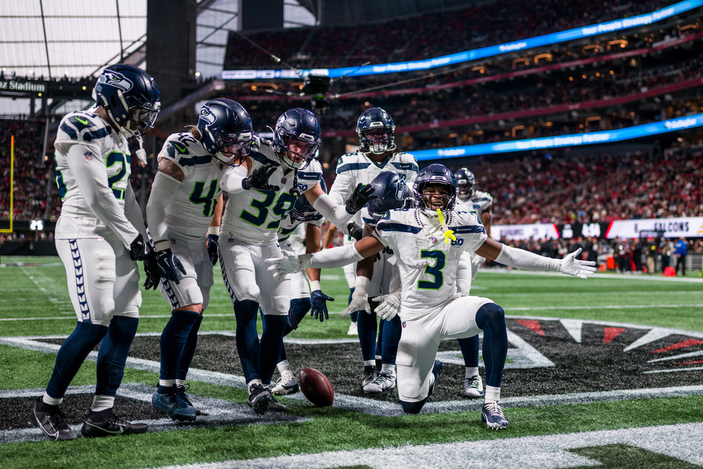 The Seahawks defense celebrates an interception in an NFL game.
