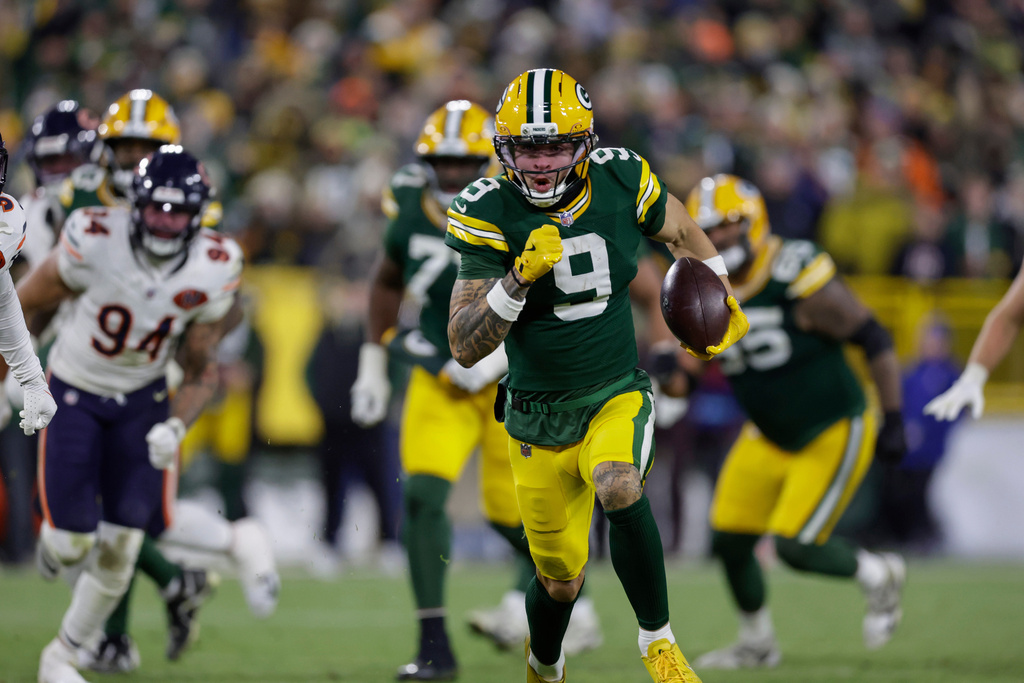 Green Bay Packers WR Christian Watson runs to the end zone against the Chicago Bears.