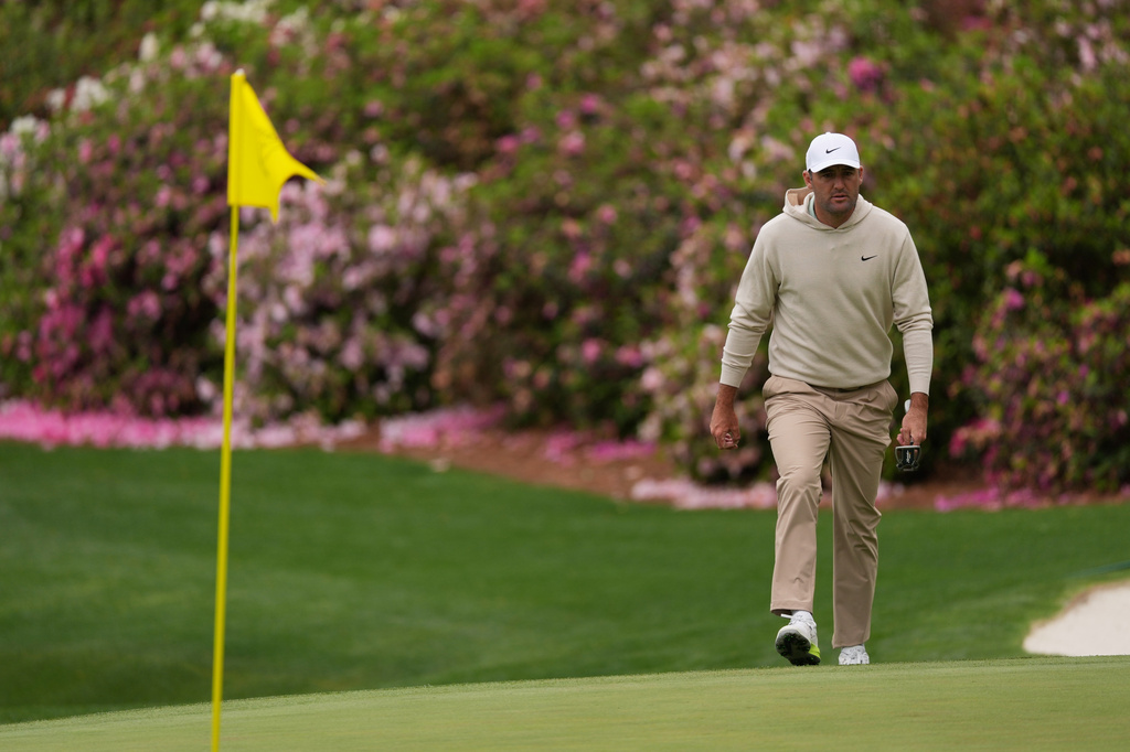 Scottie Scheffler walks to green on the 13th hole during a practice round ahead of the Masters golf tournament at the Augusta National Golf Club, Monday, April 6, 2026.