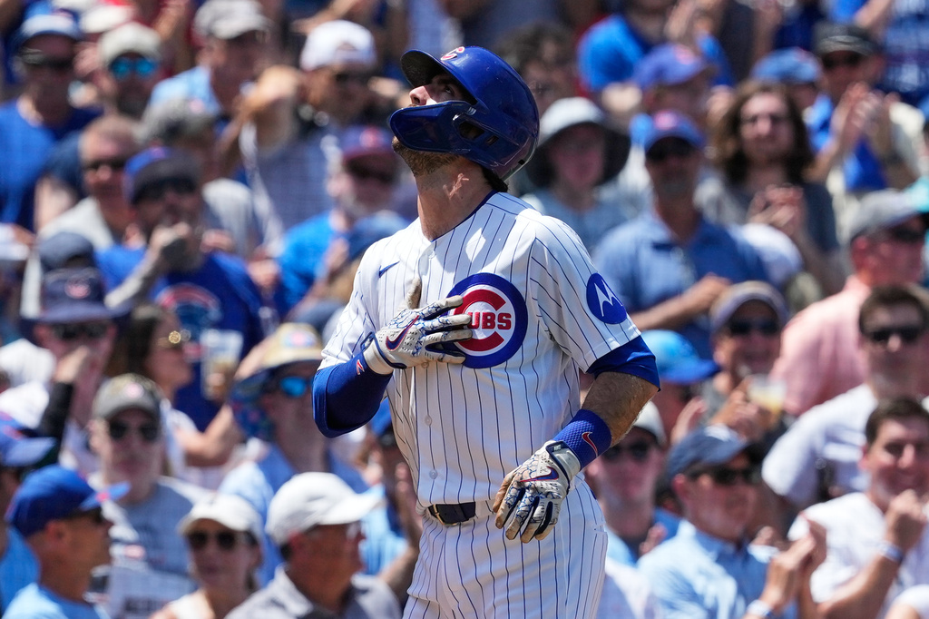 Chicago Cubs SS Dansby Swanson celebrates hitting a home run against the San Diego Padres.