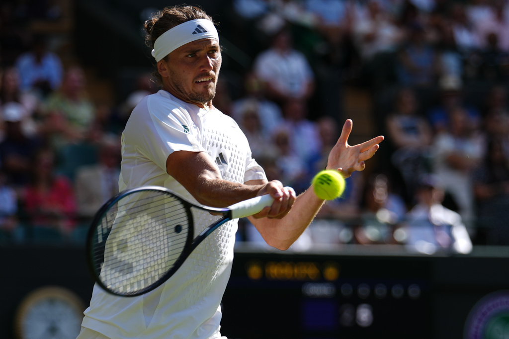 Alexander Zverev of Germany returns the ball to Marcos Giron of the United States in their third round men's singles match at the Wimbledon Tennis Championships in London, Saturday, July 4, 2026.
