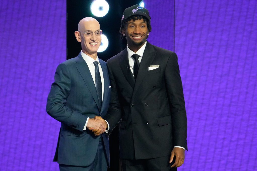 Darryn Peterson poses with NBA Commissioner Adam Silver after being selected by the Jazz at the 2026 NBA Draft.
