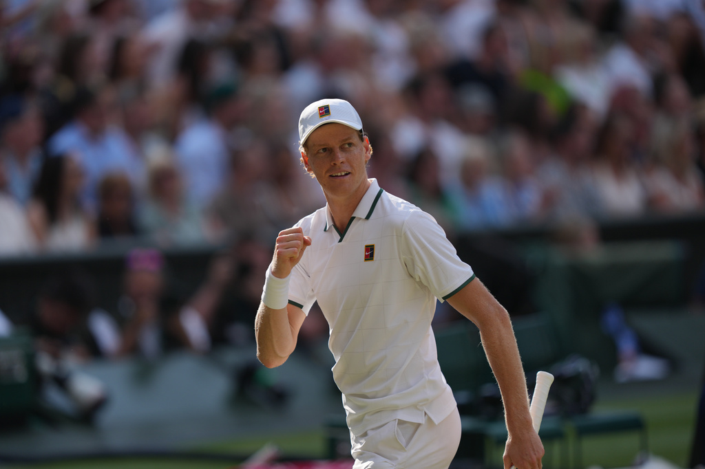 Jannik Sinner celebrates a point against Novak Djokovic during the Wimbledon.