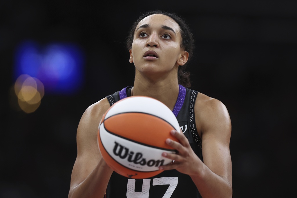Connecticut Sun G Leila Lacan lines up a shot during a WNBA game against the Indiana Fever.