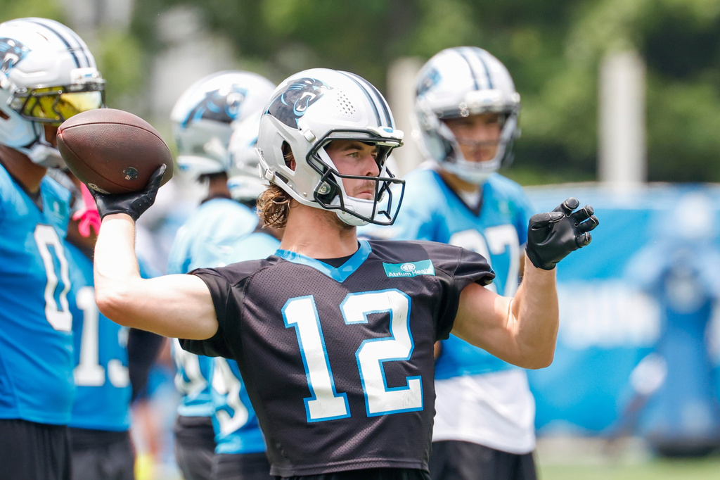 Carolina Panthers backup QB Kenny Pickett throws a pass during practice.