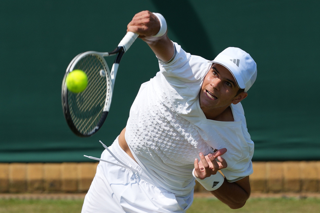 Rafael Jodar serves vs. Shintaro Mochizuki in their third round singles match at the Wimbledon.