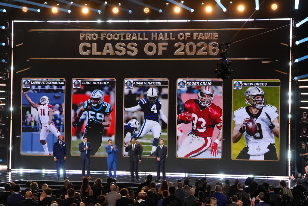 Pro Football Hall of Fame Class of 2026 Larry Fitzgerald, Luke Kuechly, kicker Adam Vinatieri, Roger Craig and Drew Brees stand of stage during the NFL Honors award show, Thursday, Feb. 5, 2026, in San Francisco.