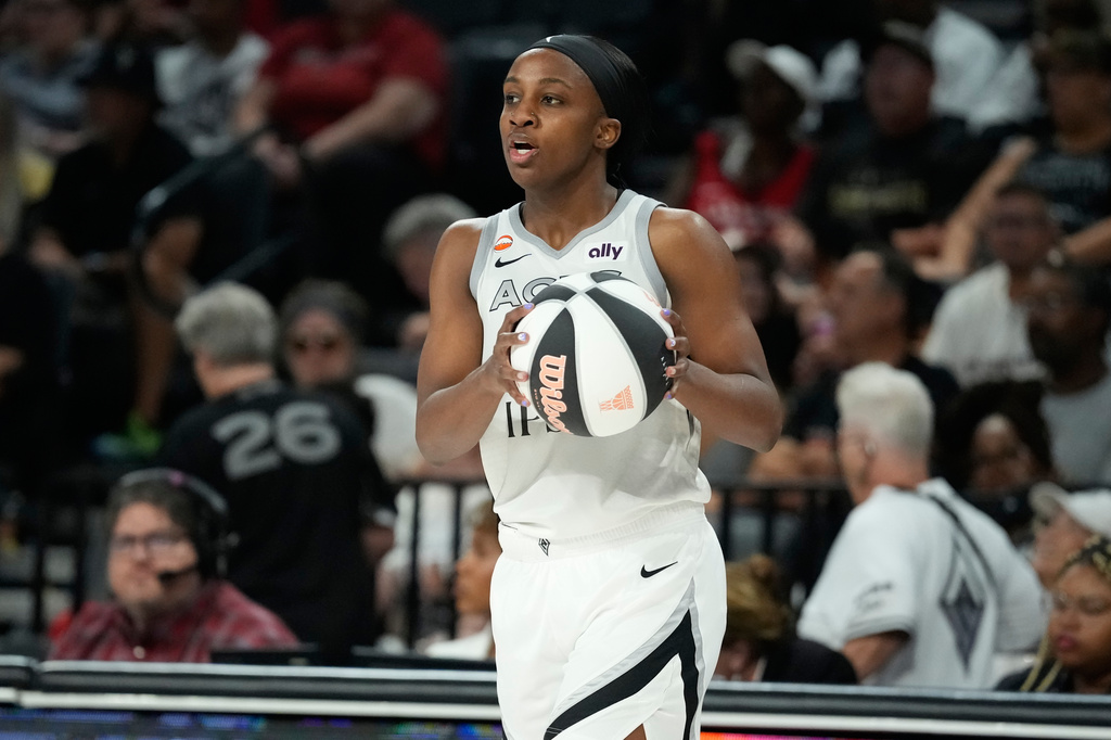 Las Vegas Aces G Jackie Young handles the ball during a WNBA game against the Minnesota Lynx.