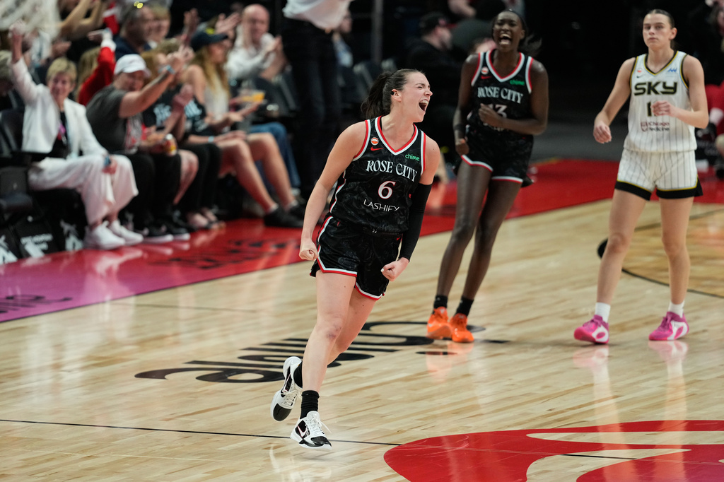 Fire F Bridget Carleton reacts after making a shot in the second half vs. the Sky.