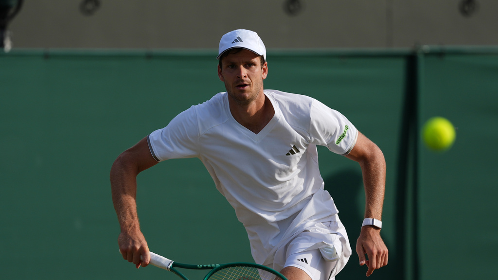 Hubert Hurkacz plays a return during a match vs. Jan-Lennard Struff at the Wimbledon.
