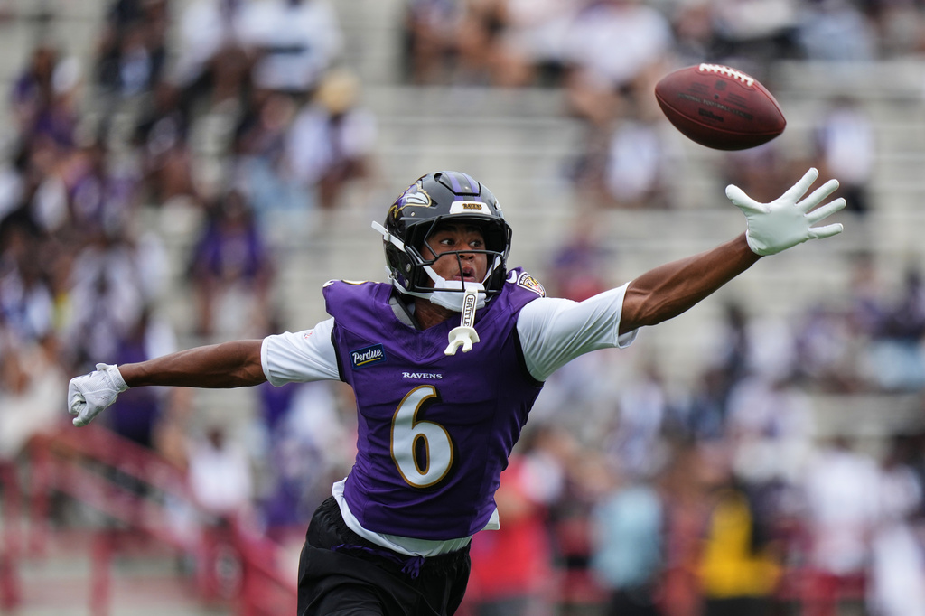 Ravens WR Ja'Kobi Lane reaches out for a catch during training camp.