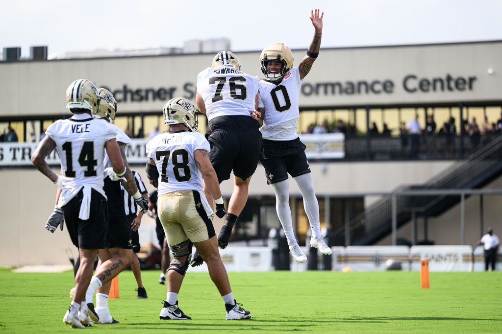 Saints WR Jordyn Tyson celebrates with his teammates following a touchdown at practice during training camp.