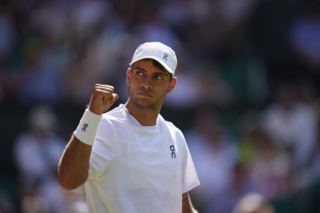 Tennis star Flavio Cobolli of Italy reacts during a match at the Wimbledon Tennis Championship.