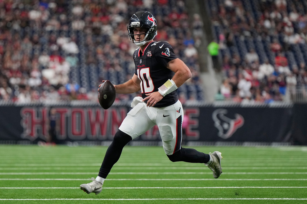 Houston Texans QB Davis Mills runs during an NFL game against the Los Angeles Chargers.