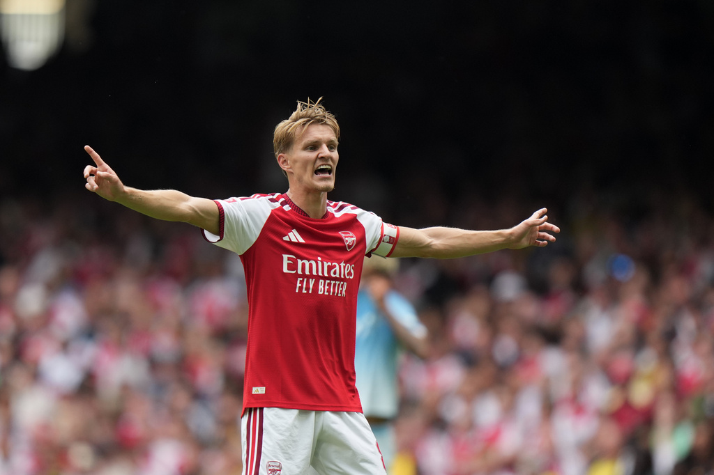 Arsenal star Martin Ødegaard celebrates during a match against Manchester City.