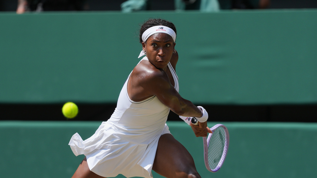Tennis star Coco Gauff focuses on a shot during a match at the Wimbledon Tennis Championship.
