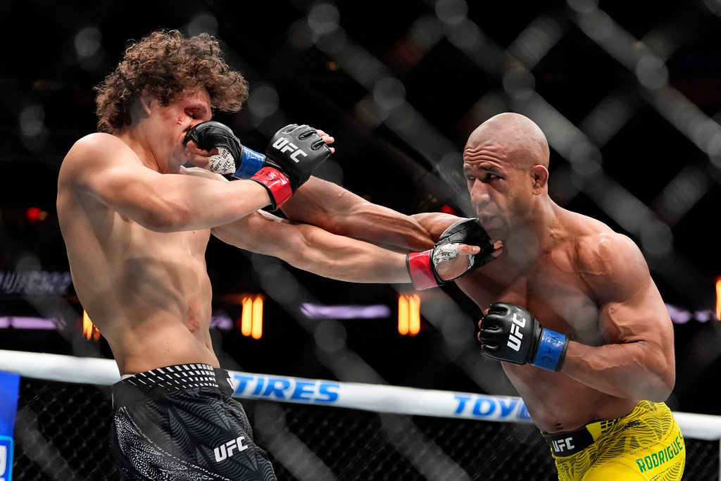Gregory Rodrigues celebrates a win against Denis Tiuliulin as he walks back to the locker room after his UFC 292 mixed martial arts fight, Saturday, August 19, 2023, in Boston. Rodrigues won via 1st round KO.