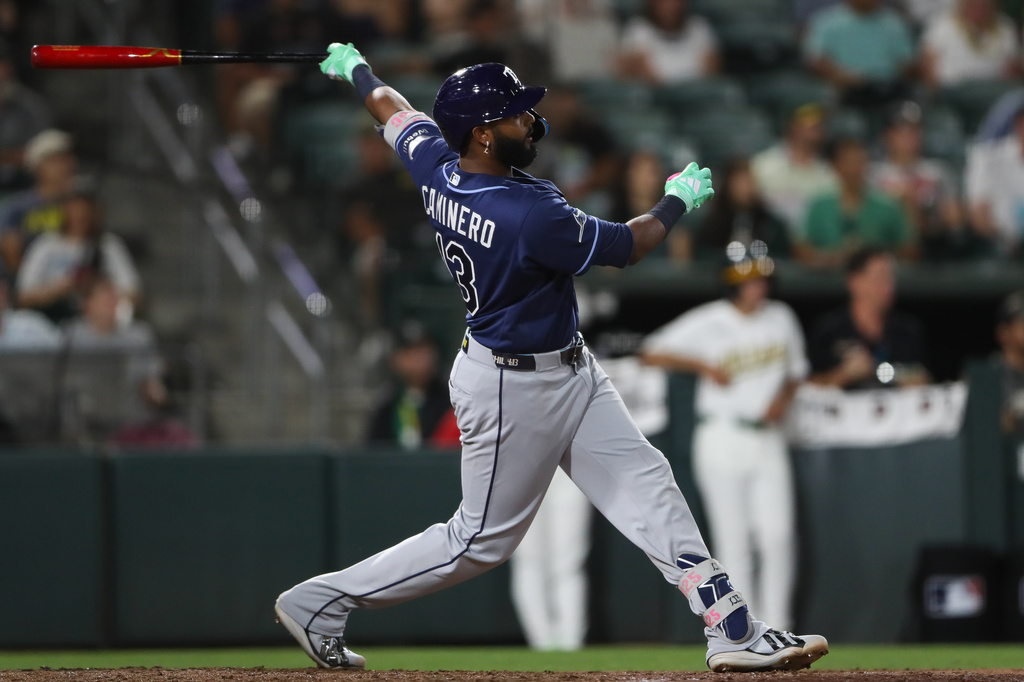 Tampa Bay Rays 3B Junior Caminero hits a home run during an MLB game against the Athletics.
