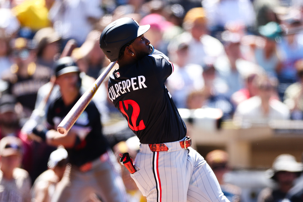 Minnesota Twins SS Kaelen Culpepper looks after his hit during an MLB game against the San Diego Padres.