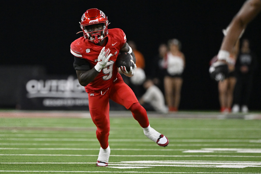 UNLV RB Jai'Den Thomas runs with the ball during the first half vs. Nevada.