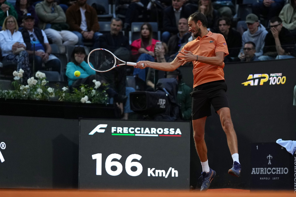 Daniil Medvedev returns the ball to Martin Landaluce during an Italian Open match in Rome.